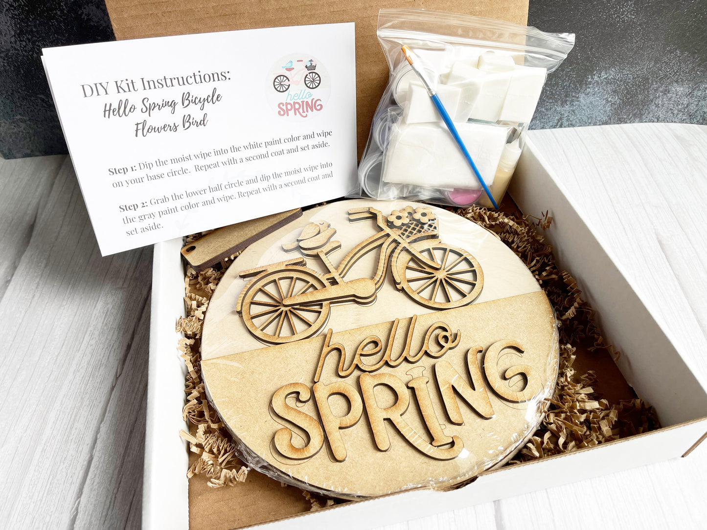 a cake in a box that says hello spring