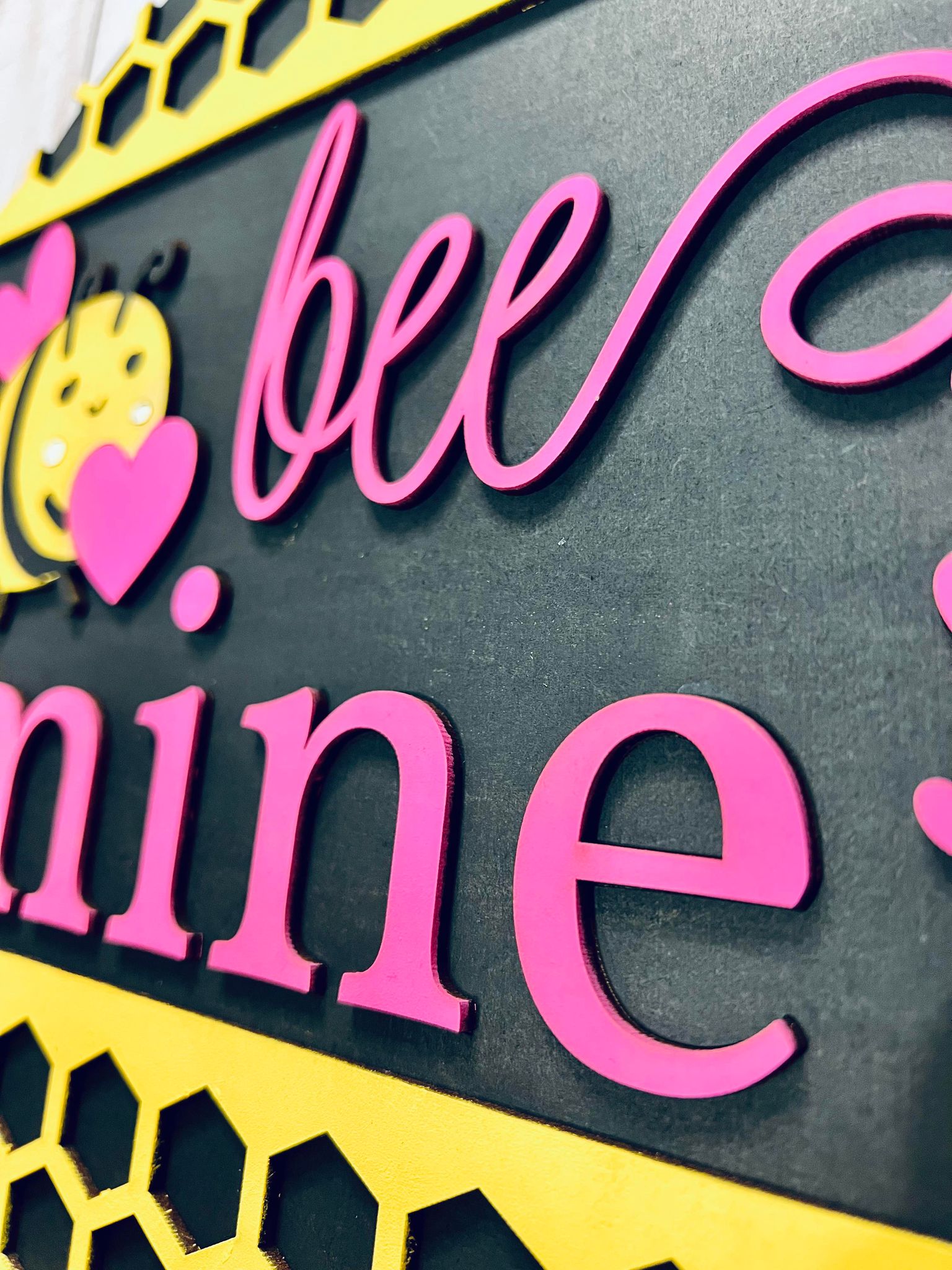 a close up of a sign that says bee mine