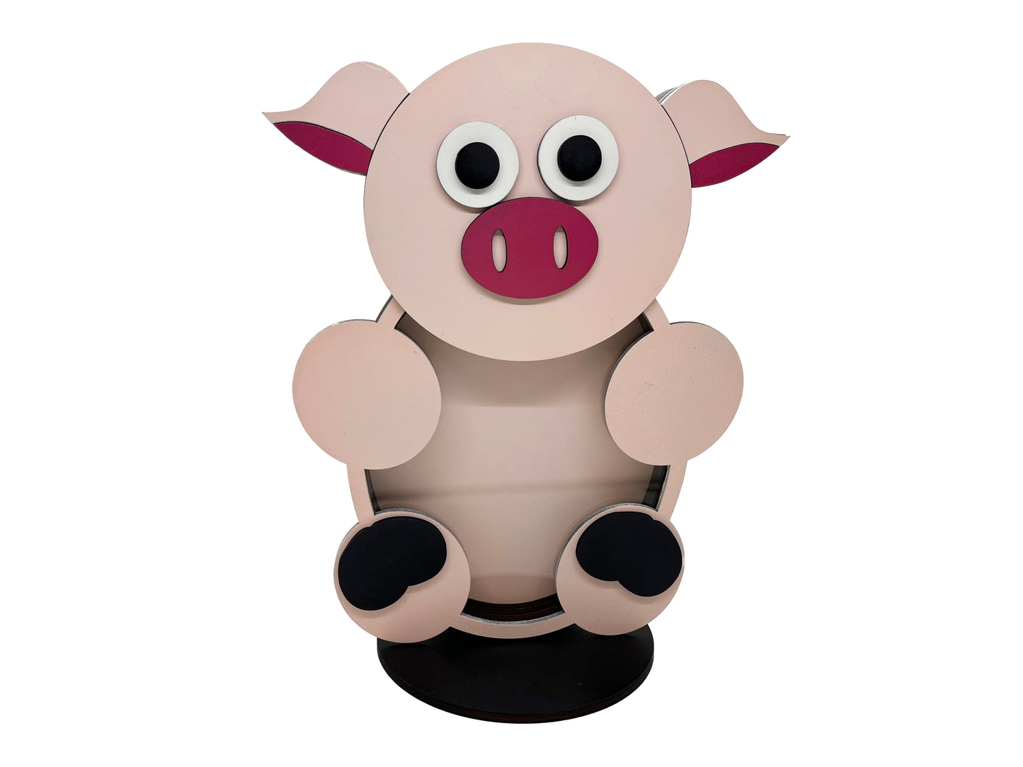 a pink pig sitting on top of a black stand