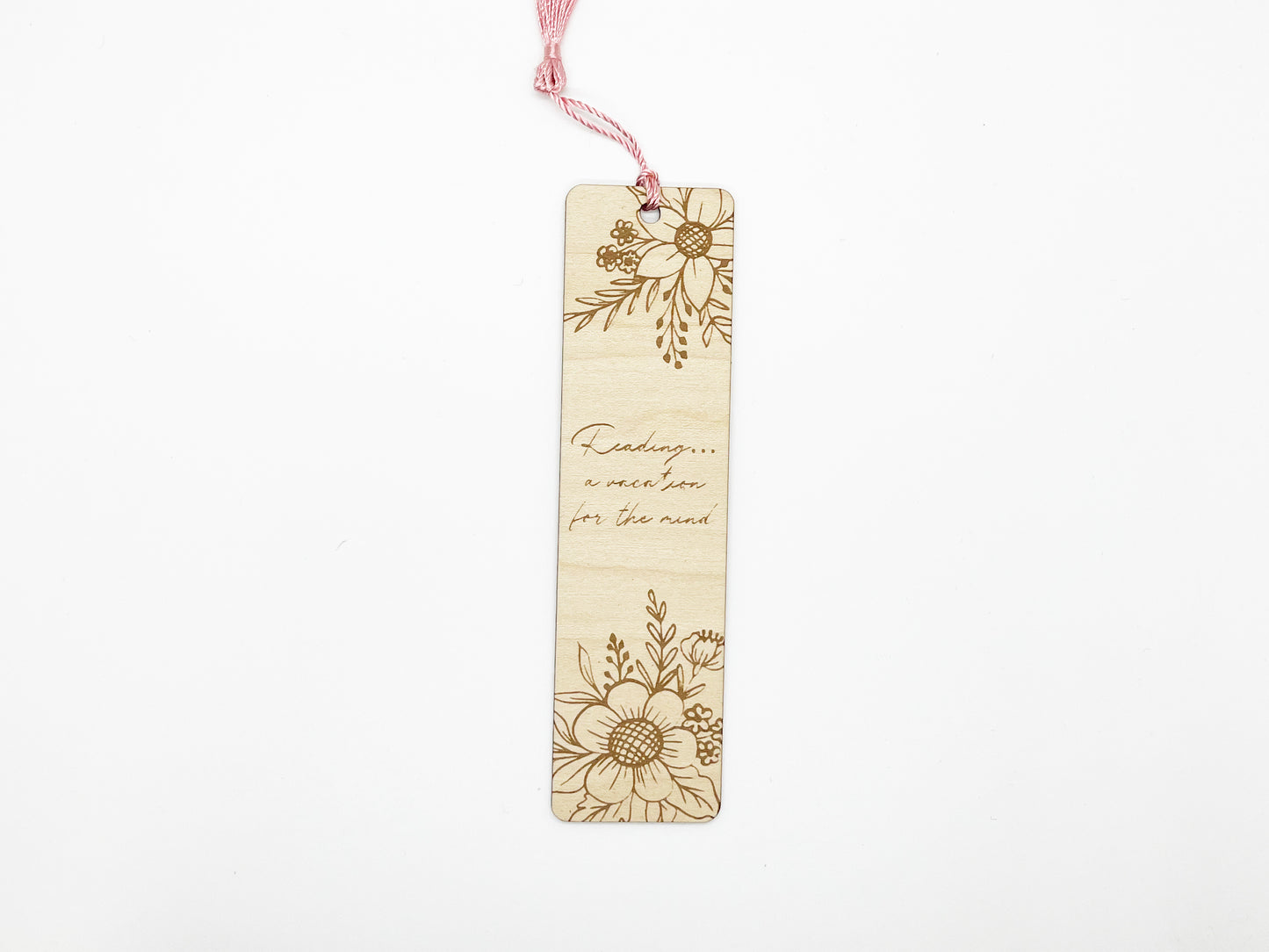 a wooden bookmark with a picture of flowers on it