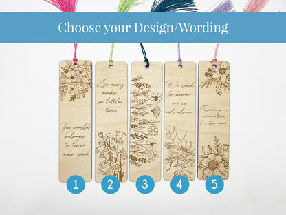 a set of four wooden bookmarks with different designs on them