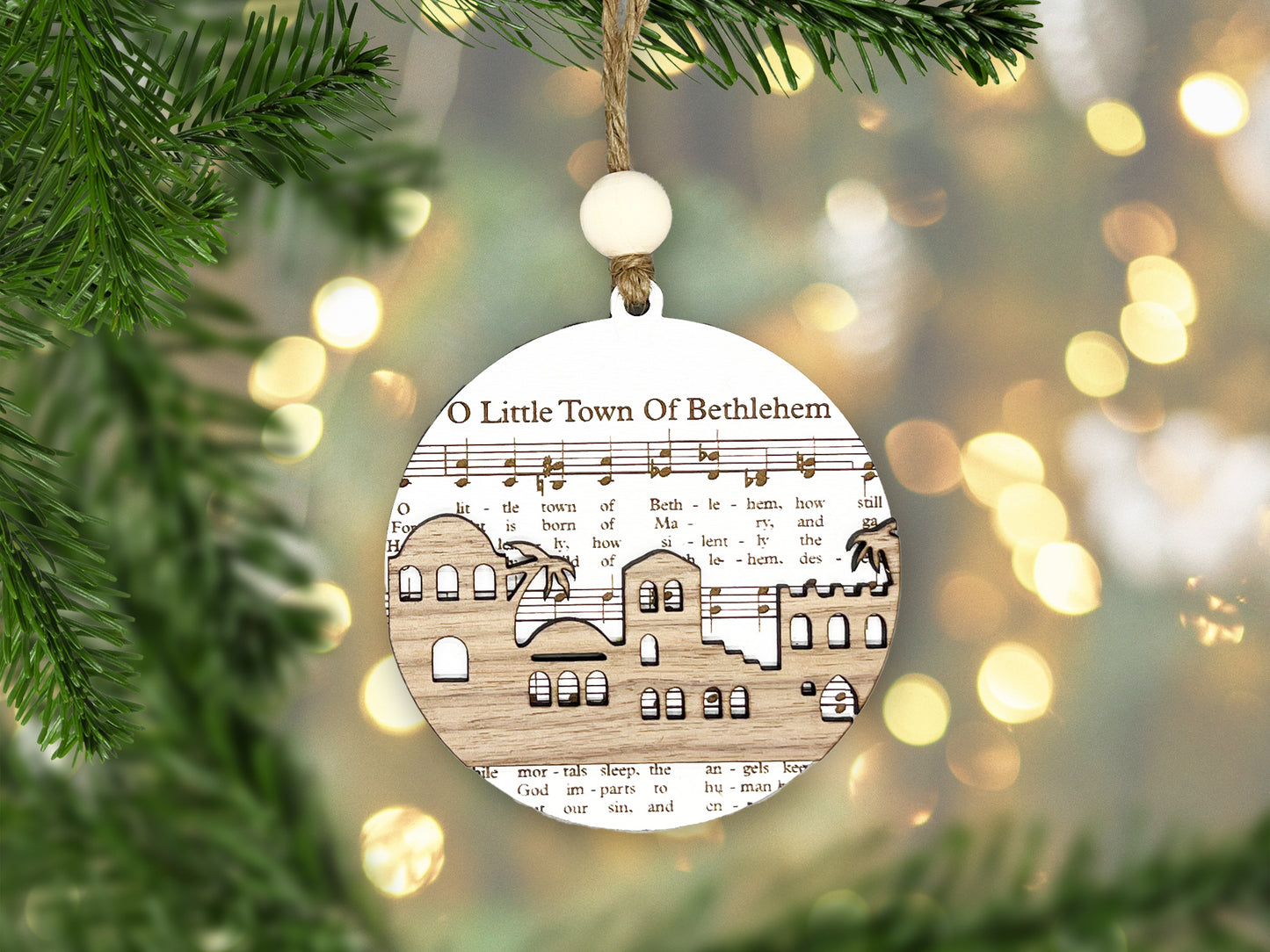 a wooden ornament hanging from a christmas tree