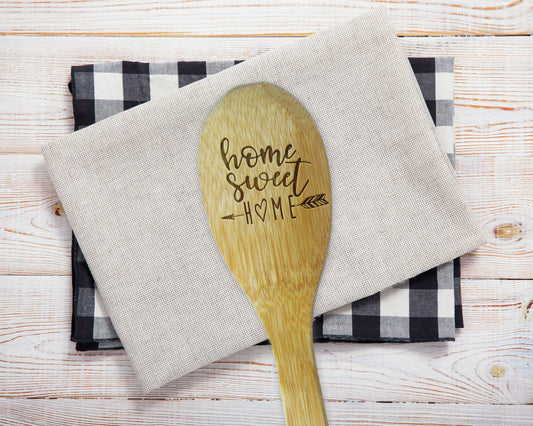 a wooden spoon sitting on top of a napkin