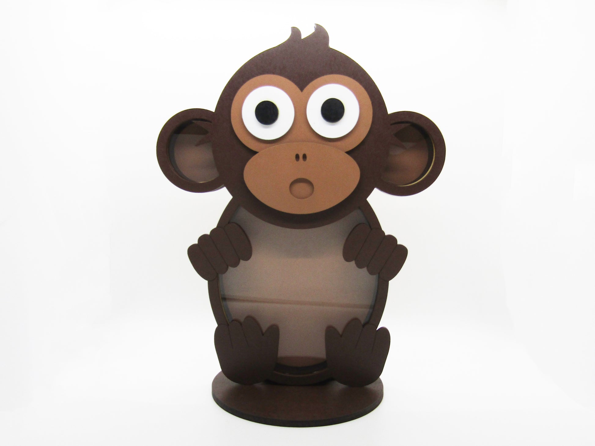 a paper toy of a monkey with big eyes