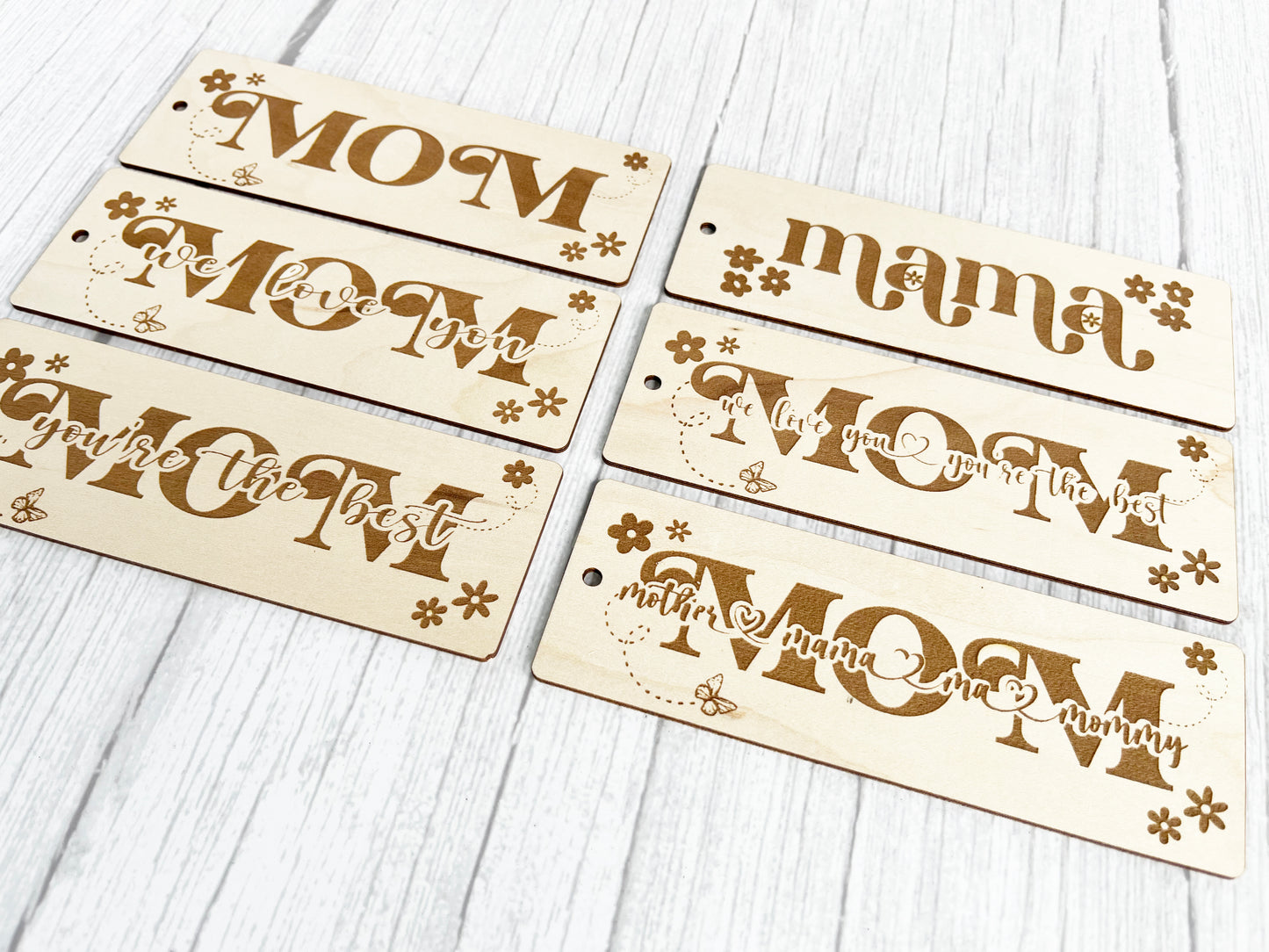 four wooden signs that say mom, mom, mom, mom