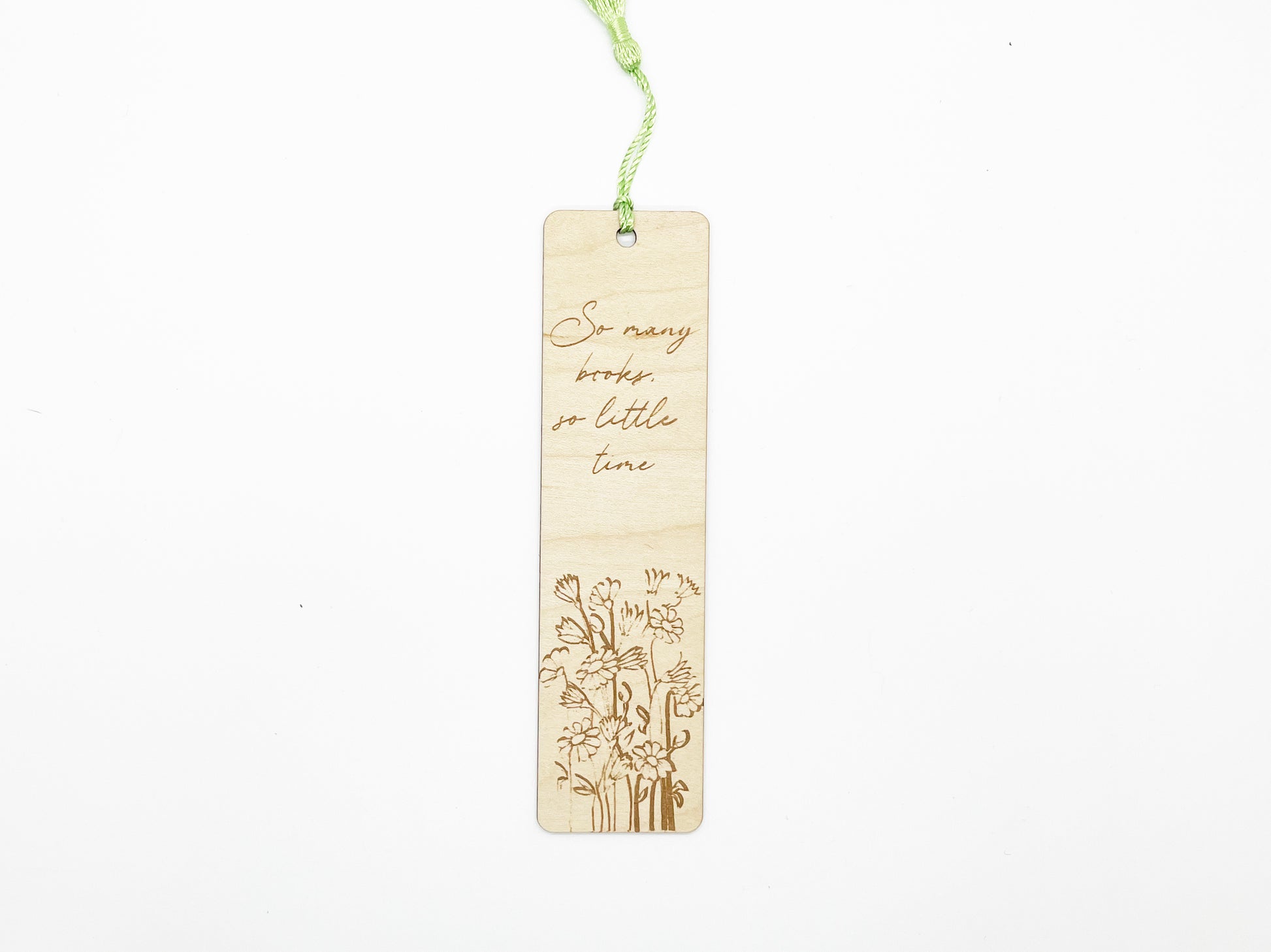 a wooden bookmark with a picture of a tree