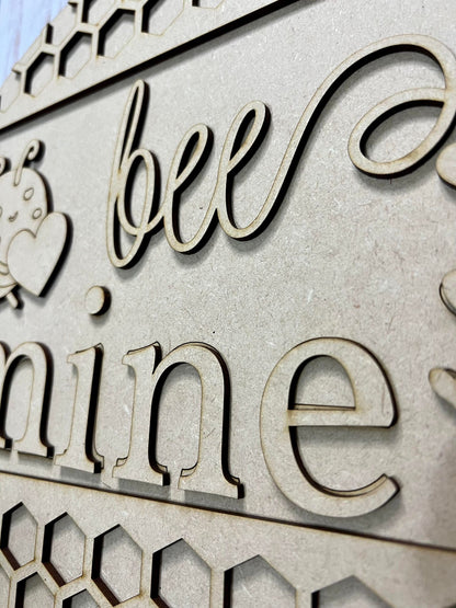 a close up of a sign that says bee mine