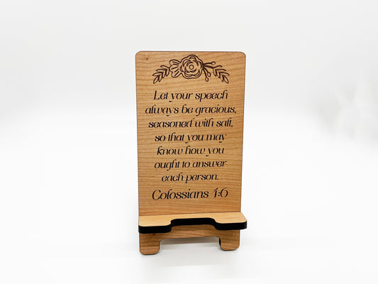 a wooden plaque with a quote on it