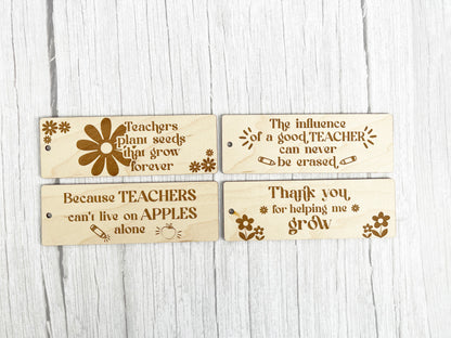 three wooden tags with words on them