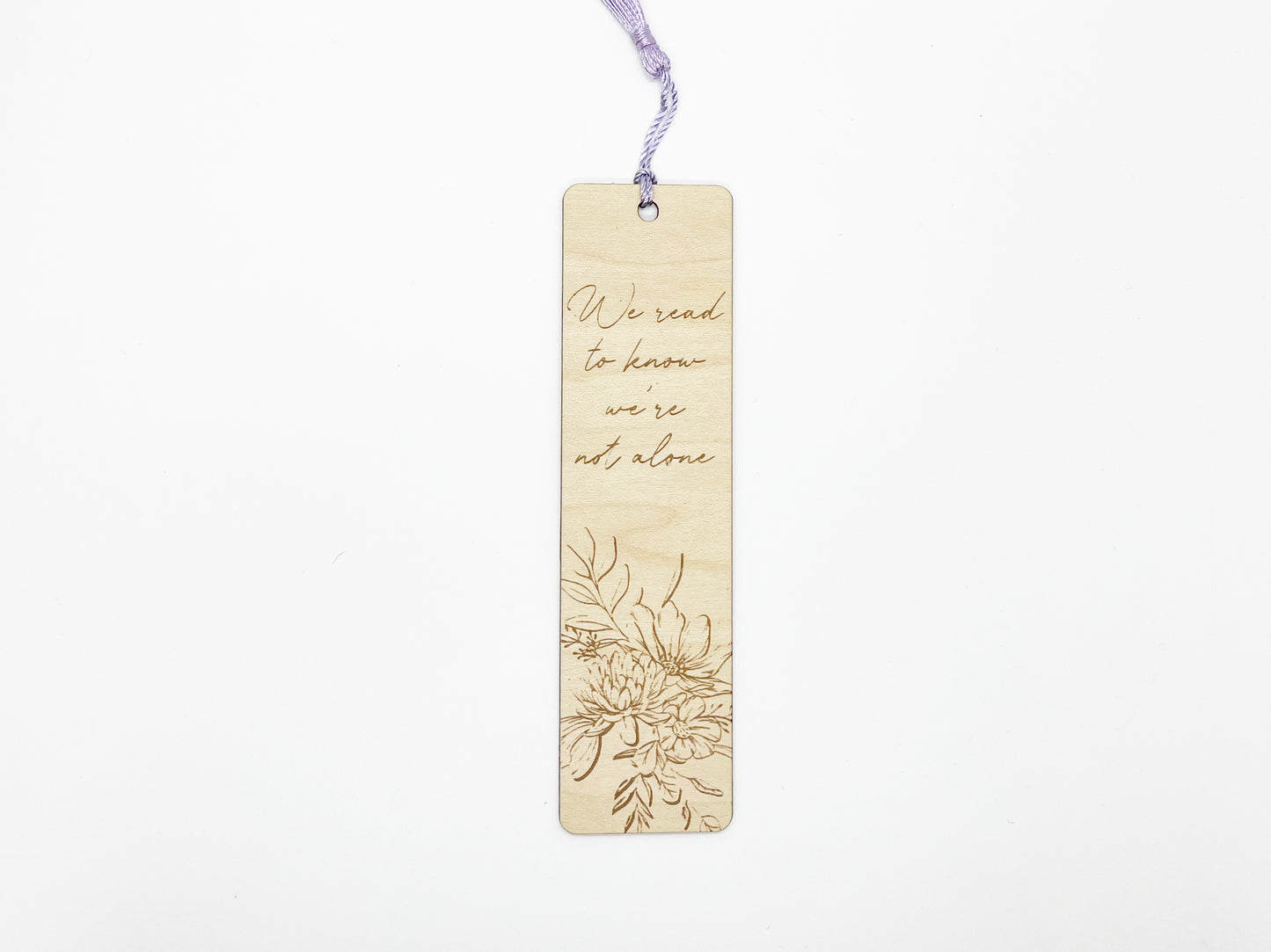 a wooden bookmark with a picture of flowers on it