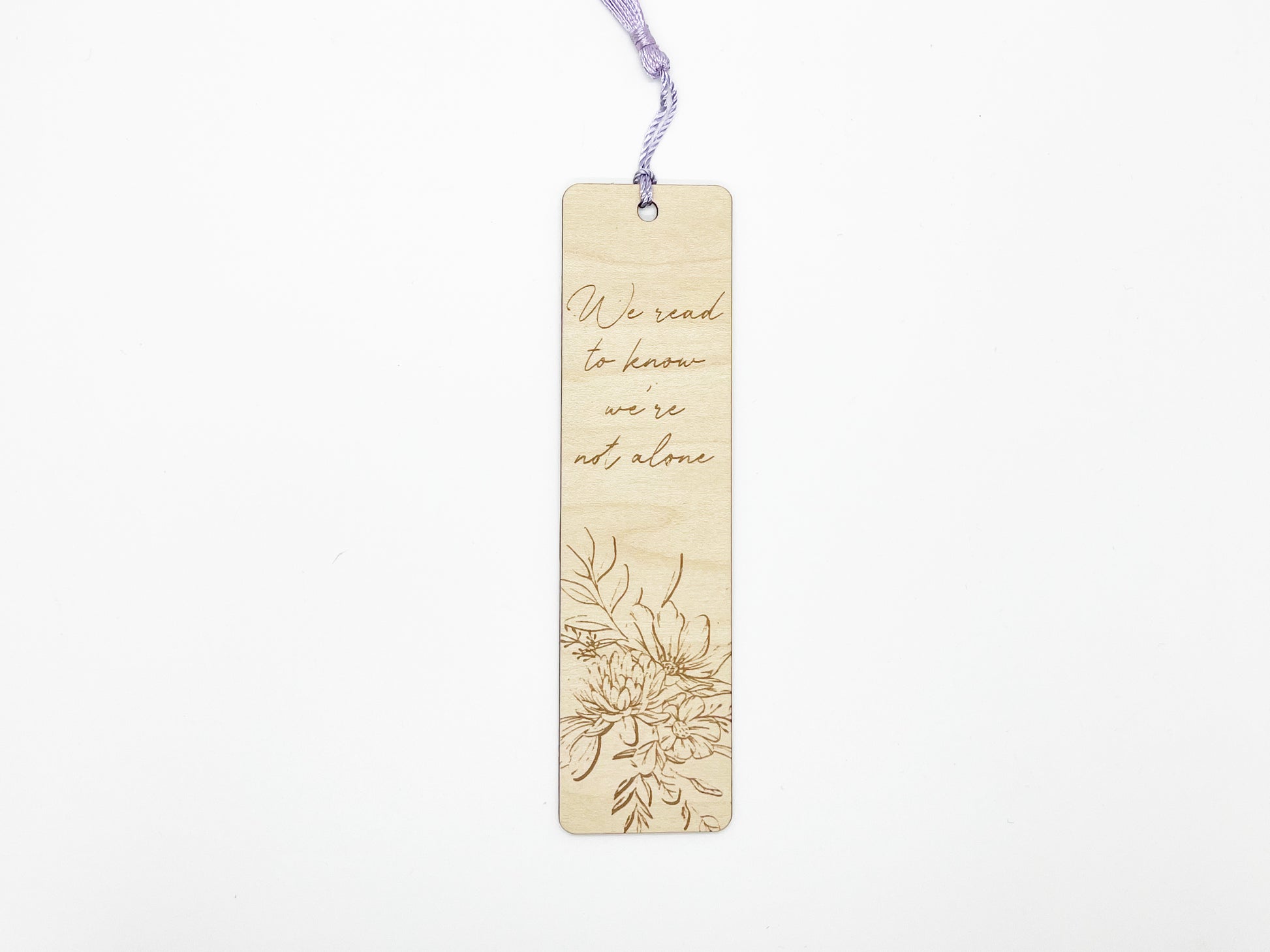 a wooden bookmark with a picture of flowers on it