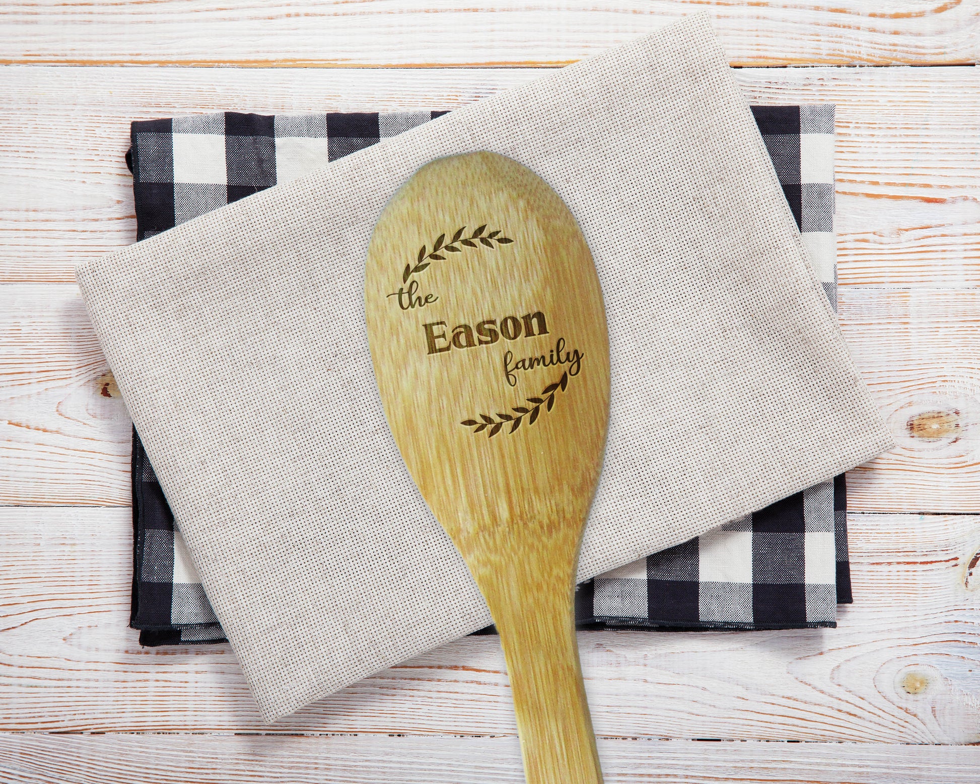 a wooden spoon sitting on top of a napkin