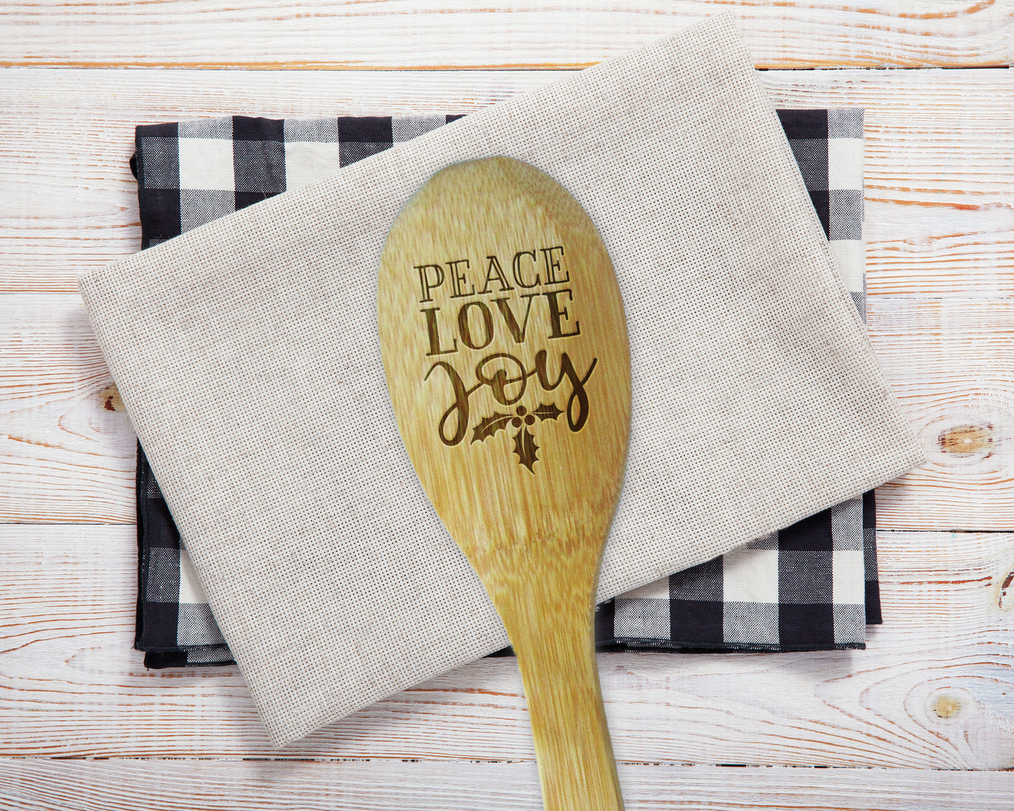 a wooden spoon sitting on top of a napkin