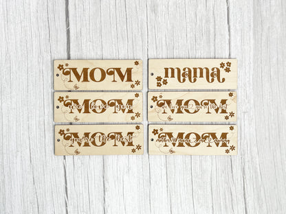 three wooden signs that say mama, move, move, move