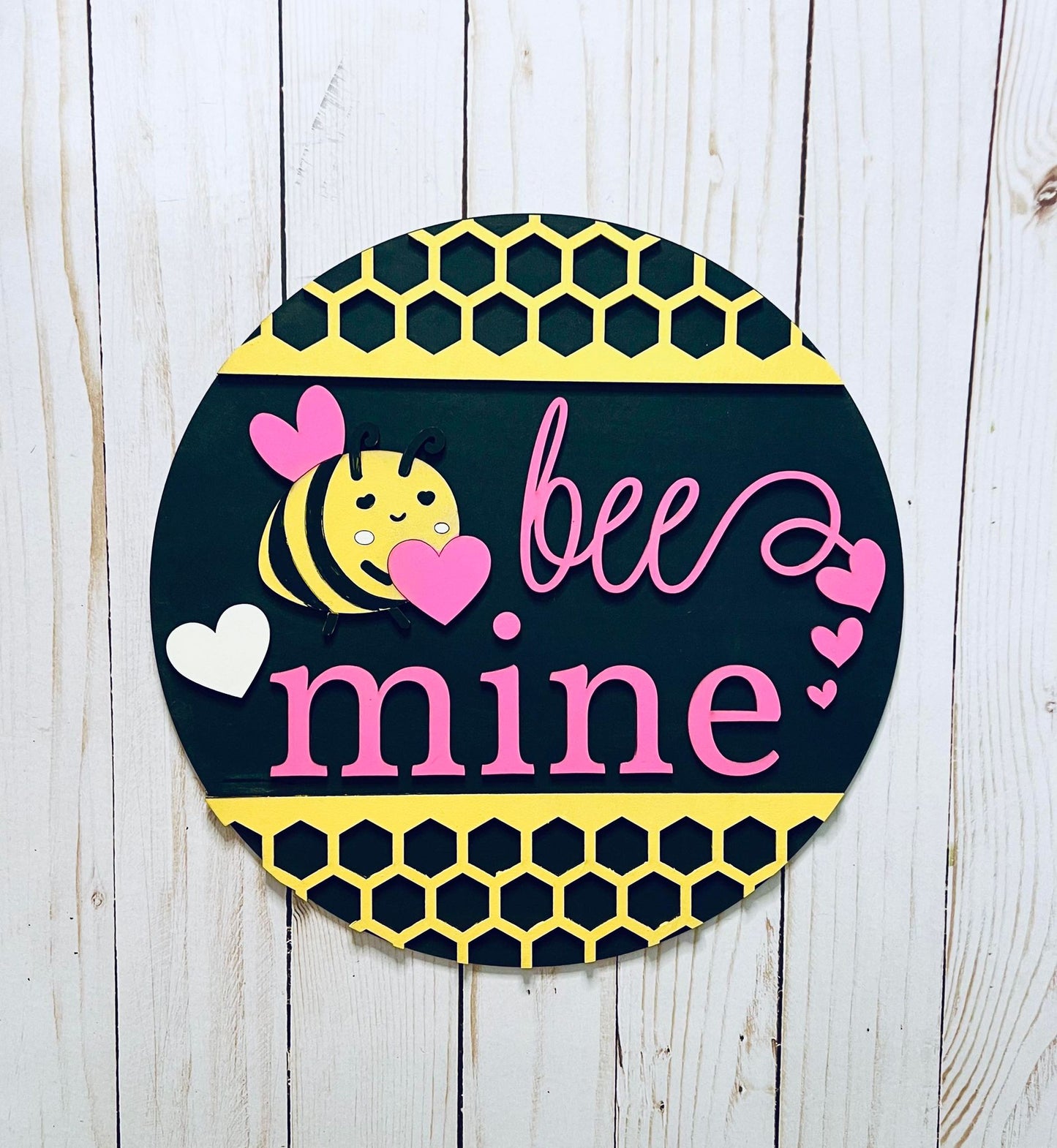 a black and yellow sign that says bee mine