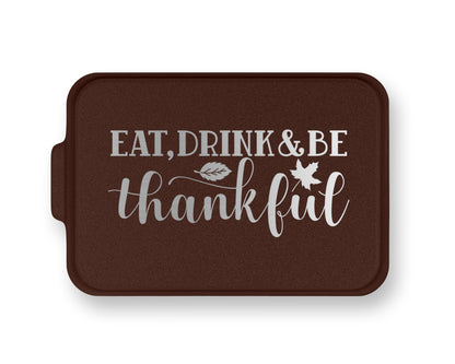 a brown tray with the words eat, drink and be grateful on it