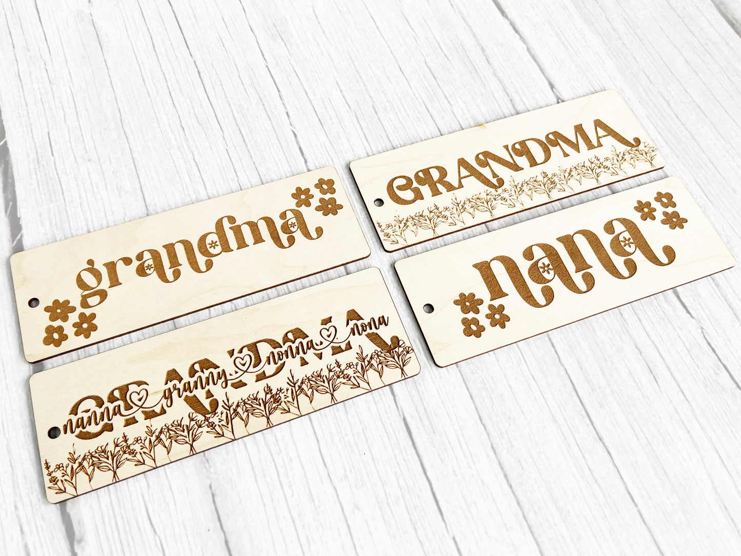 three wooden name tags on a white table