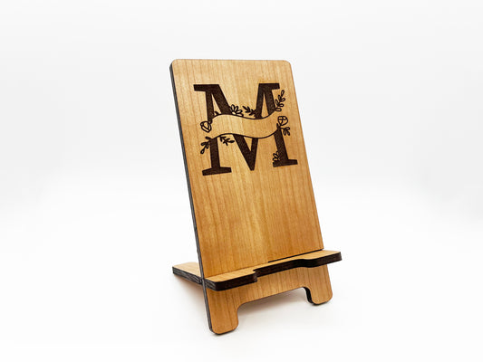 a wooden sign with the letter m on it