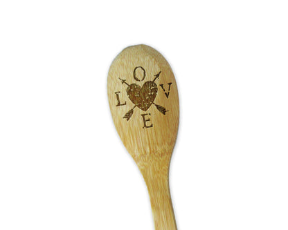 a wooden spoon with a heart on it